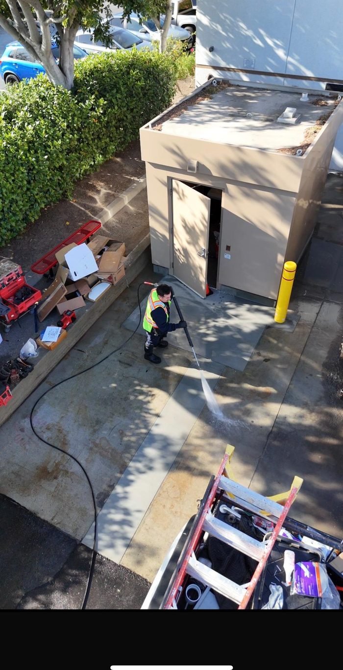 Commercial building exterior washing in progress
