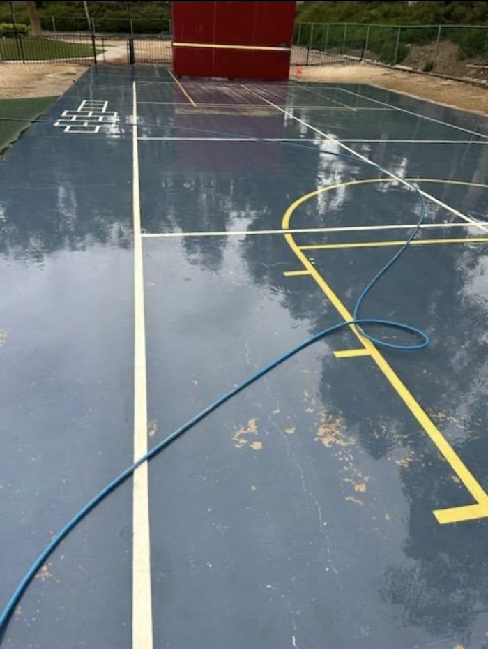 Outdoor sports-court pressure washing