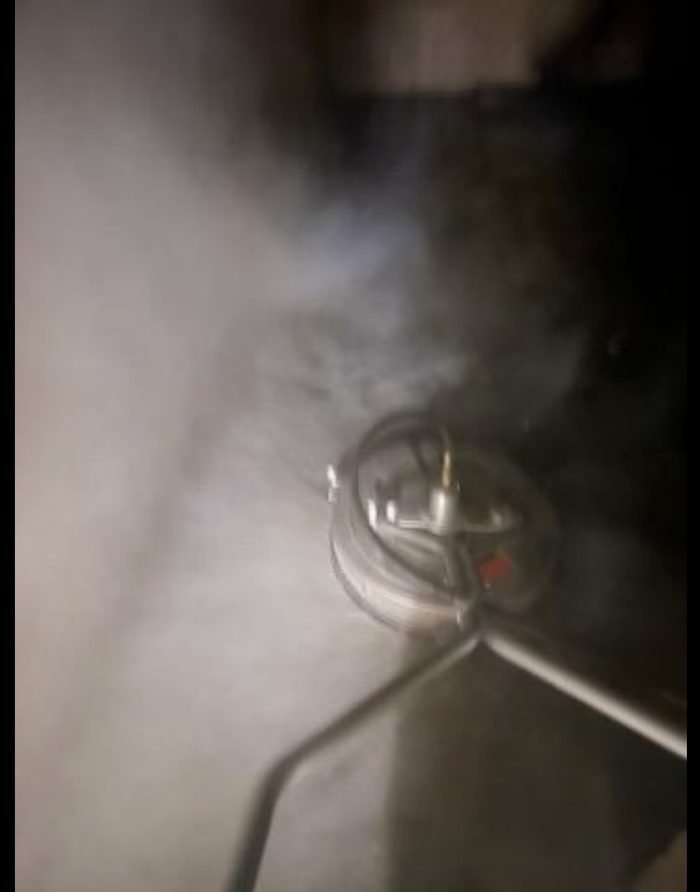 Commercial concrete cleaning or pressure-washing equipment in use